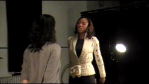 Sharma MacDonald in dramatic scene with fellow actor.